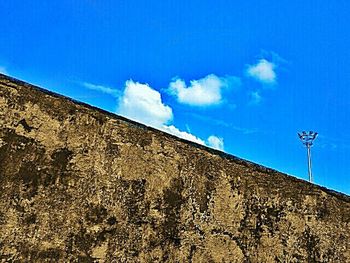 Low angle view of built structure against blue sky