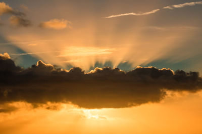 Low angle view of dramatic sky during sunset