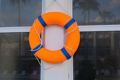 Close-up of orange umbrella with reflection