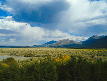 Landscape with mountain range in background