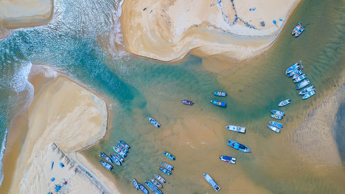 Aerial view of boats moored at beach