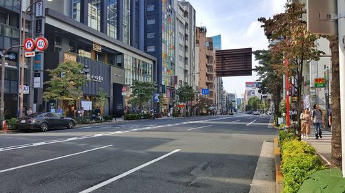 Road amidst buildings in city