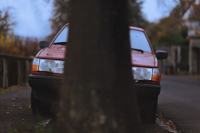 Volvo behind a tree
