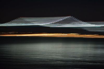 Illuminated building against sky at night