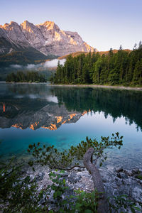 Beautiful and colorful sunrise at a lake in the bavarian alps. 