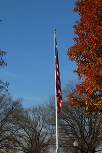 Low angle view of flag against clear sky