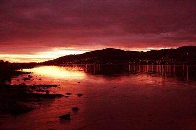 Scenic view of silhouette mountains against sky during sunset