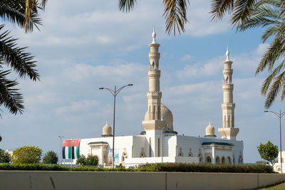 View of buildings against cloudy sky