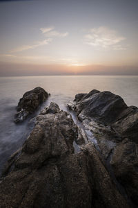 Scenic view of sea against sky during sunset