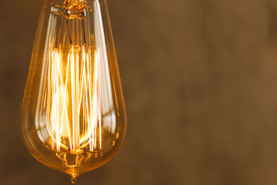 Close-up of illuminated light bulb