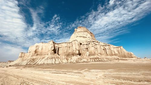 Rock formations on mountain against sky