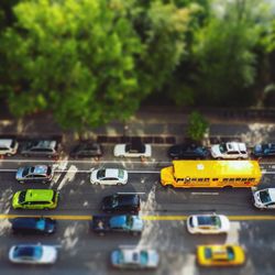 Close-up of yellow car on road