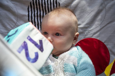 High angle view of cute baby with gift