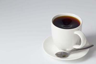 Coffee cup against white background