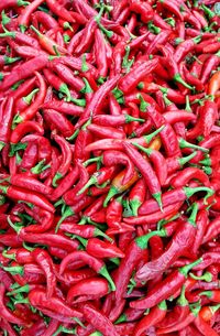 Full frame shot of red chili peppers for sale in market