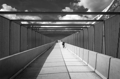 Rear view of people walking in corridor