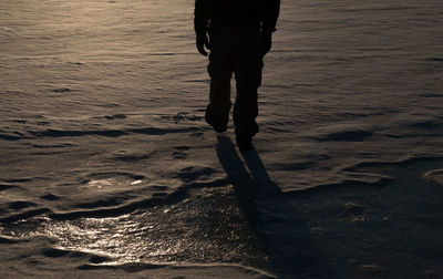 Low section of woman standing on ground