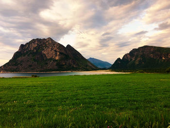 Scenic view of landscape and mountains against sky