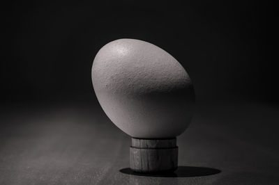 Close-up of drink on table against black background