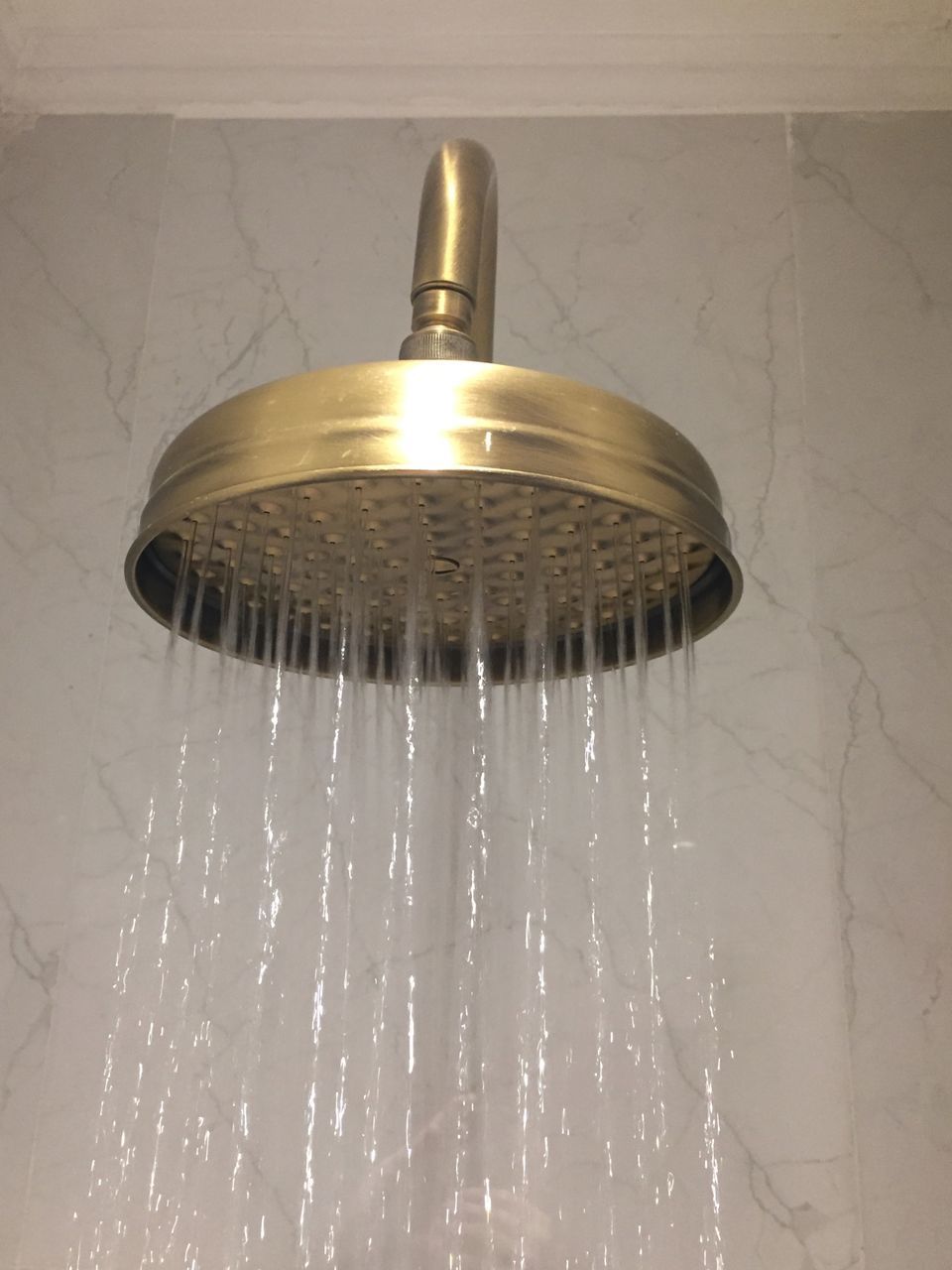 CLOSE-UP OF WATER SPLASHING IN BATHROOM