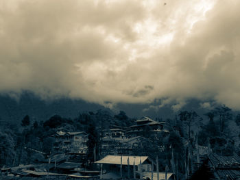 Aerial view of townscape against sky during winter