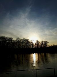 Scenic view of lake at sunset