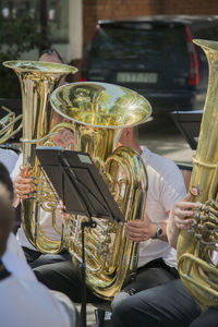 Close-up of people playing trumpet