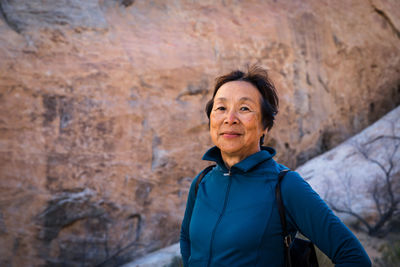 Portrait of senior asian woman in the desert landscape