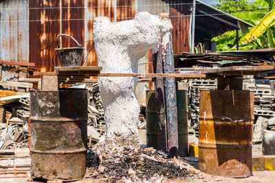 Close-up of stack of logs in building