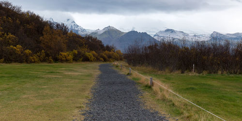Road passing through field