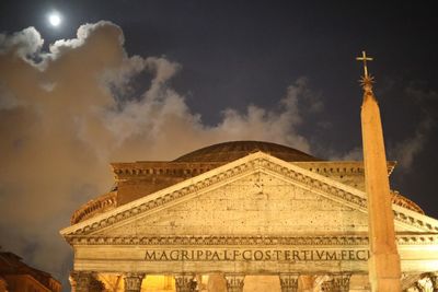 Low angle view of historical building against cloudy sky