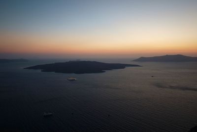 Scenic view of sea against clear sky during sunset