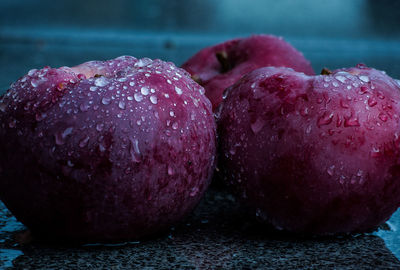 Close-up of wet apple on table