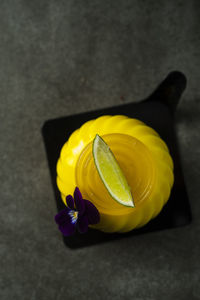 Close-up of yellow flower over black background