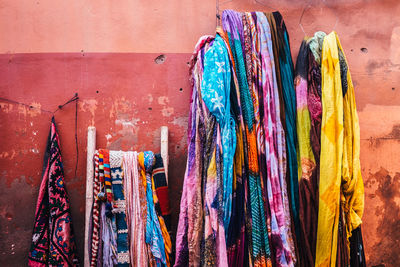 Colorful clothing hanging on wall