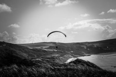 Scenic view of mountain against sky paragliding 