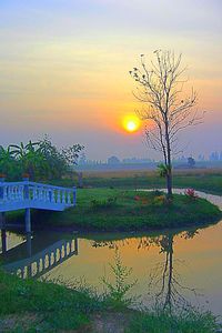 Scenic view of lake against sky during sunset