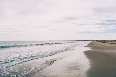 Scenic view of beach against sky