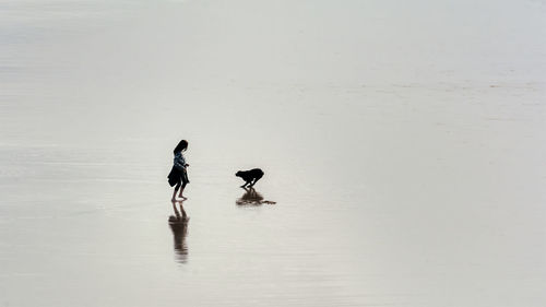 Full length of a young man swimming in lake