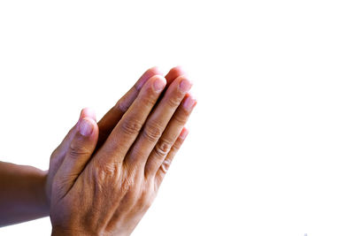 Close-up of human hand against white background