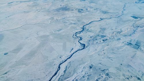 Full frame shot of snow covered land and river