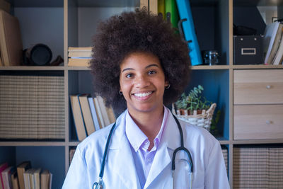 Portrait of smiling young woman in hospital