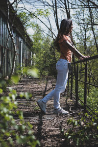 Side view of woman standing on abandoned ramp