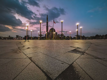 View of illuminated building against sky during sunset