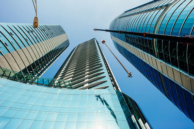 Low angle view of modern buildings against clear sky