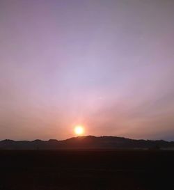 Scenic view of silhouette landscape against sky during sunset