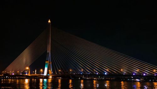 Low angle view of suspension bridge at night