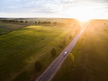 Scenic view of field against sky during sunny day