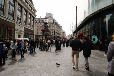 People walking on street in city