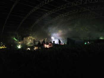 View of illuminated tunnel at night